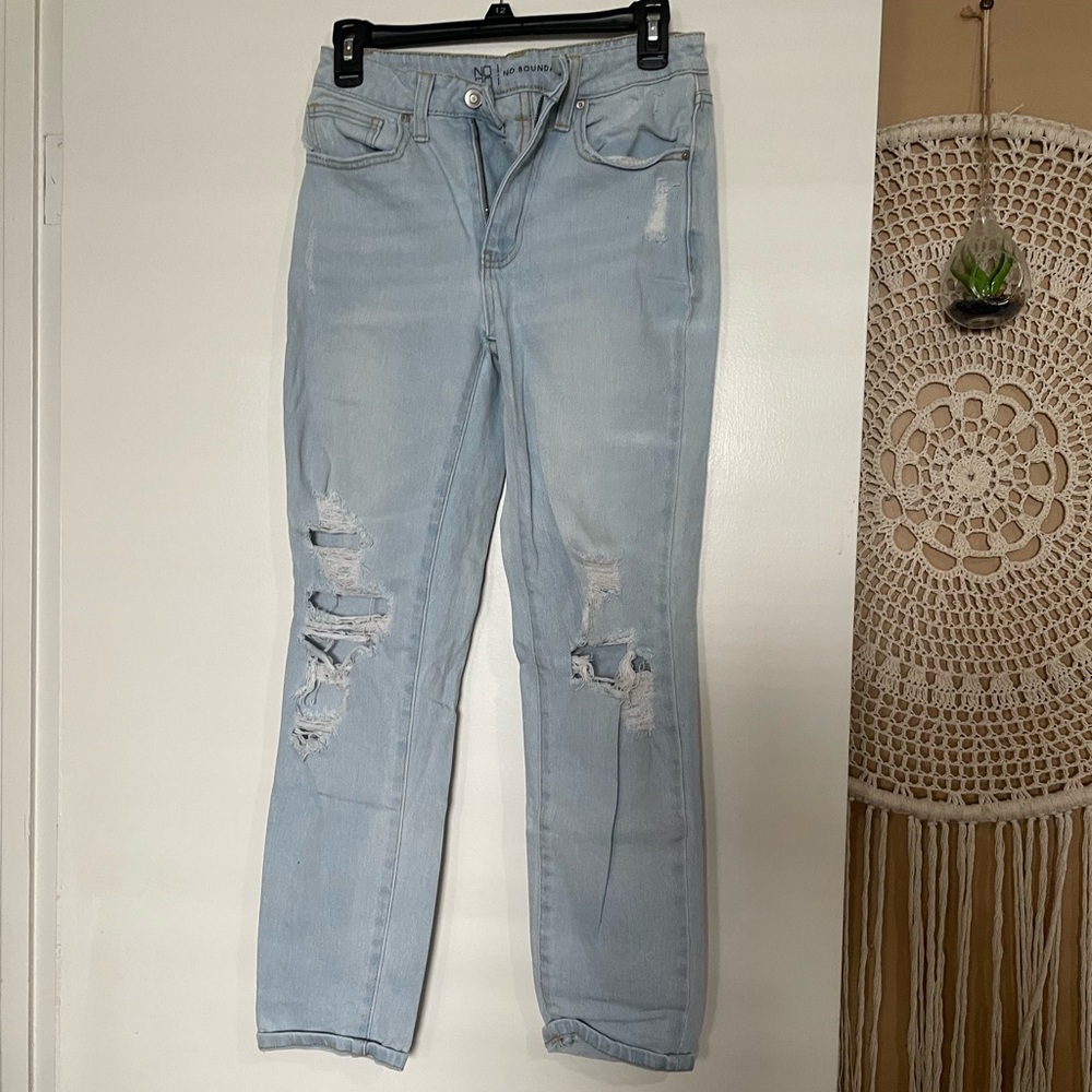 Light wash ripped jeans size 3 slight mom jean fit.